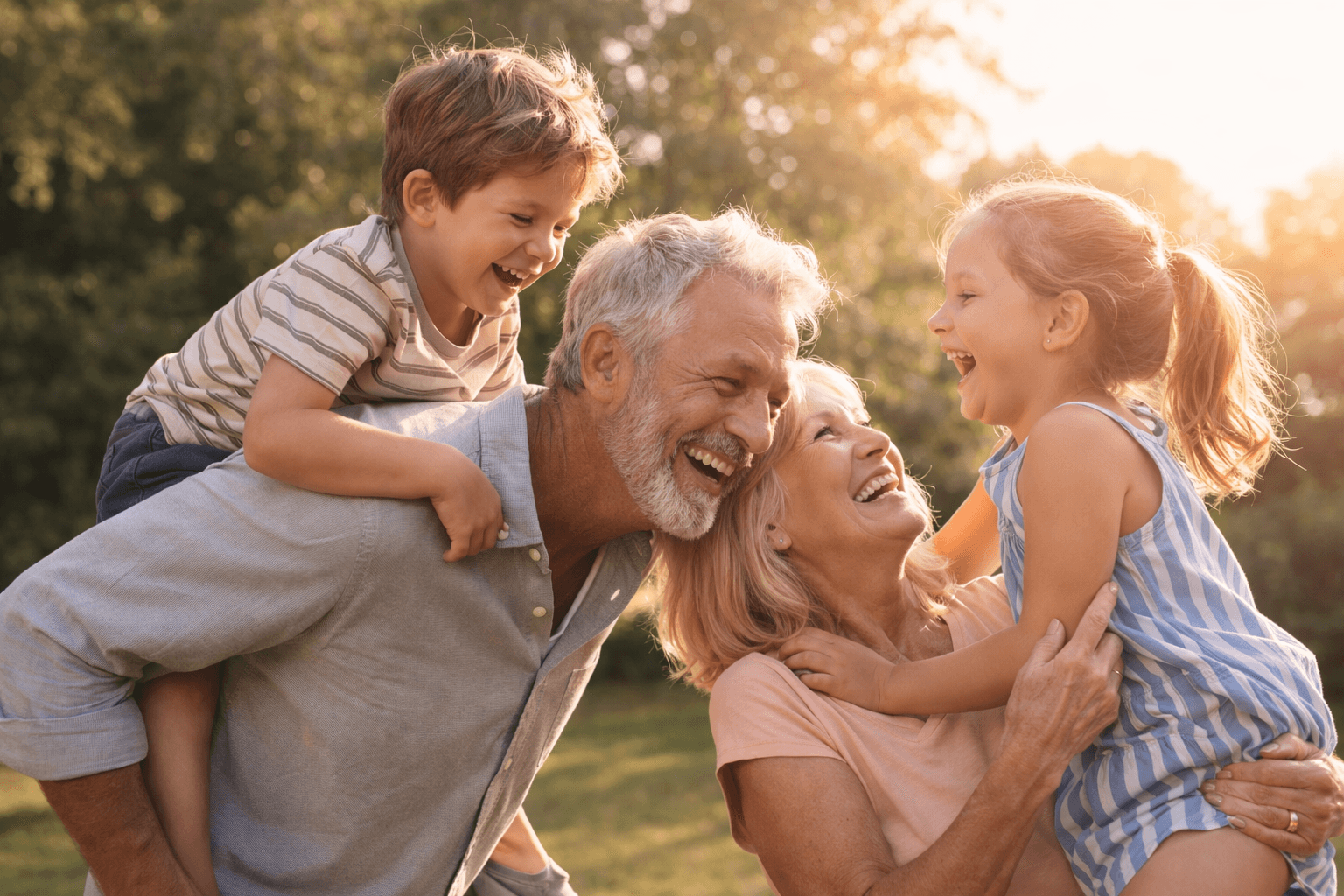 Grandparents laughing with grandchildren outdoors — healthspan and connection